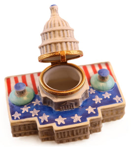 Decorative box with a miniature model of the U.S. Capitol building on a white background